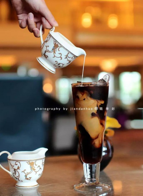 American afternoon tea with Chicago hot dog and iced coffee