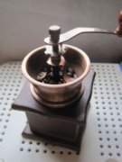 The process of grinding coffee by hand